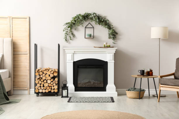 istock Stylish room decorated with beautiful eucalyptus garland above fireplace 1414484478