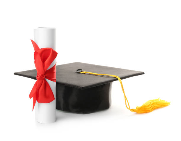 istock Graduation hat and diploma on white background 1414484863