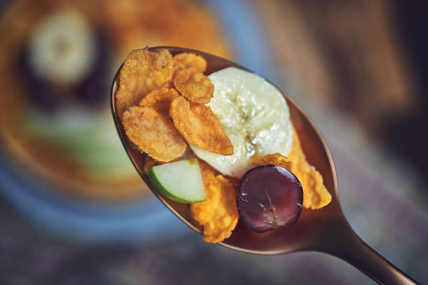 Cornflakes with Banana, Apples and Grapes for Breakfast