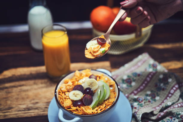 Cornflakes with Banana, Apples and Grapes for Breakfast