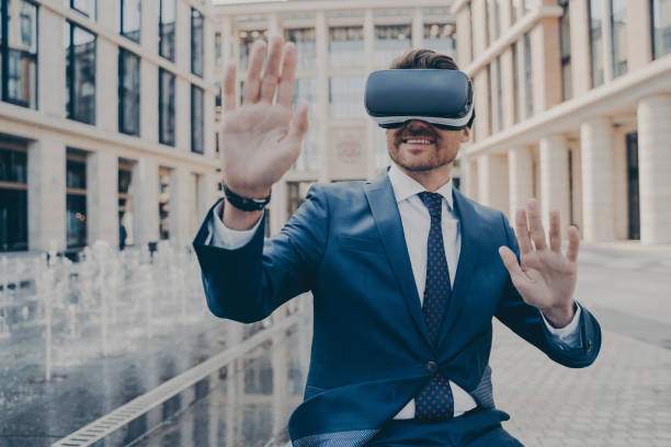 istock Excited office worker in formal suit checking information in virtual reality 1414492548
