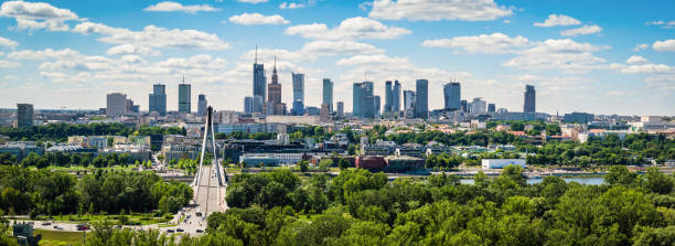 Swietokrzyski bridge and skyscrapers in city center, Warsaw aerial landscape under blue sky Swietokrzyski bridge and skyscrapers in city center, Warsaw aerial panoramic landscape under blue sky warszawa stock pictures, royalty-free photos & images