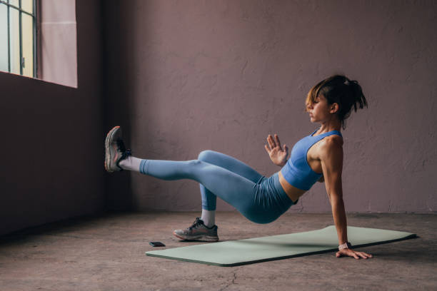 istock Woman Exercising In The Gym 1414498072