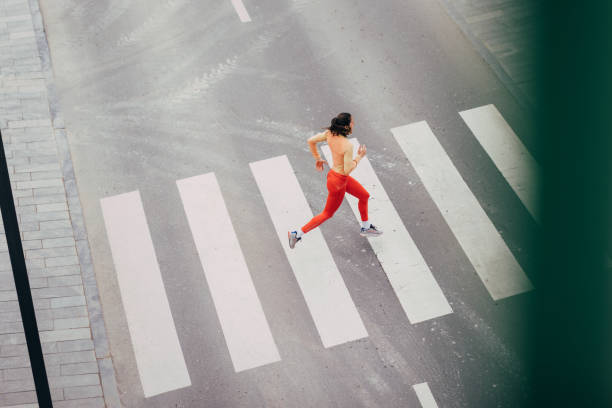 istock Woman Running On The Road 1414498160