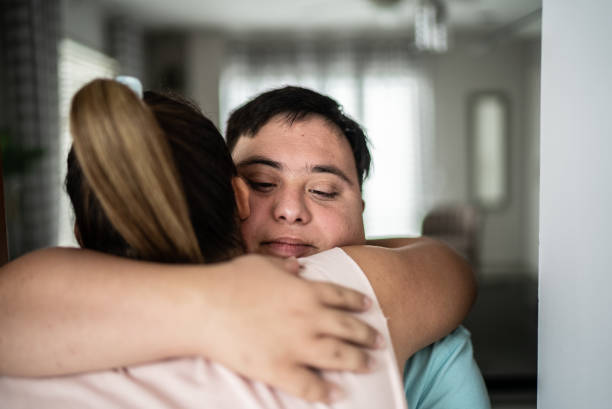 istock Special needs couple embracing at home 1414515353