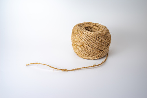 Roll of hemp string isolated on white background