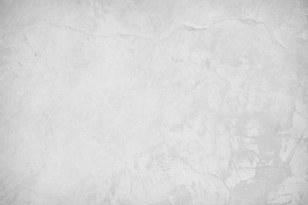 istock White concrete texture polished wall background. Grey retro plain color cement crack have sand and stone seamless of panoramic for decorative design element architecture urban smooth vintage surface. 1414521197