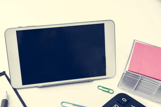 istock Important Messages Tablet On Desk With Pen, Notebook, Cup And Notes. Crutial Informations On Cellphone Screen On Table With Notepad, Coffee And Memos. 1414522110
