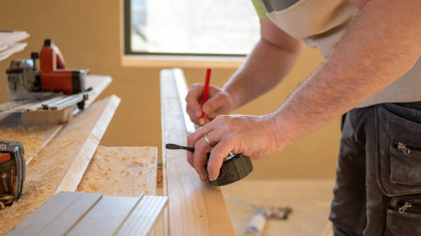 istock Man measuring dimension by tape measure, final woodworks on wall linings 1414522761