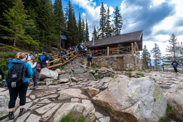 Line of tourists wait for service at the Lake Agnes tea house in Banff National Park stock photo