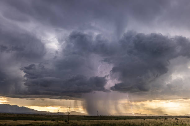 Sunset Lightning during Monsoon Storm Lightning strikes during a monsoon storm southeast of Sonoita, Arizona just before sunset. Microburst stock pictures, royalty-free photos & images