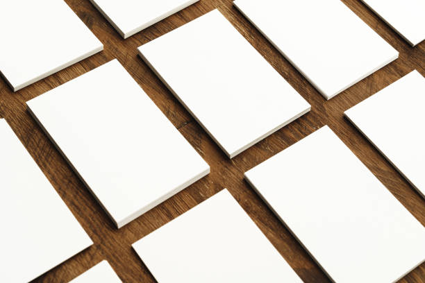 istock Blank businesscard stacks on rough wooden table 1414528609