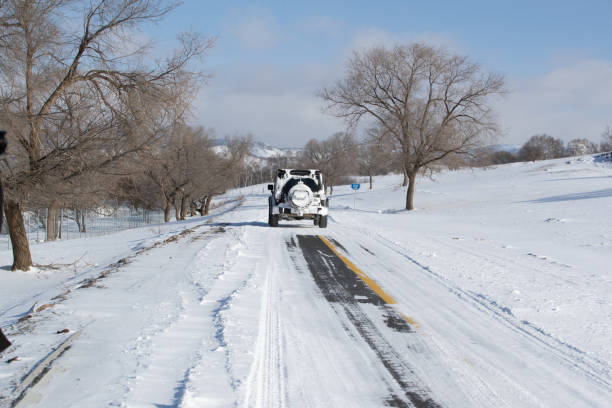 istock Traces of the car on snow 1414539351