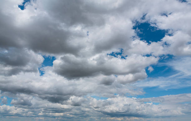 istock Cumulus clouds in a blue sky for background and layer 1414555396