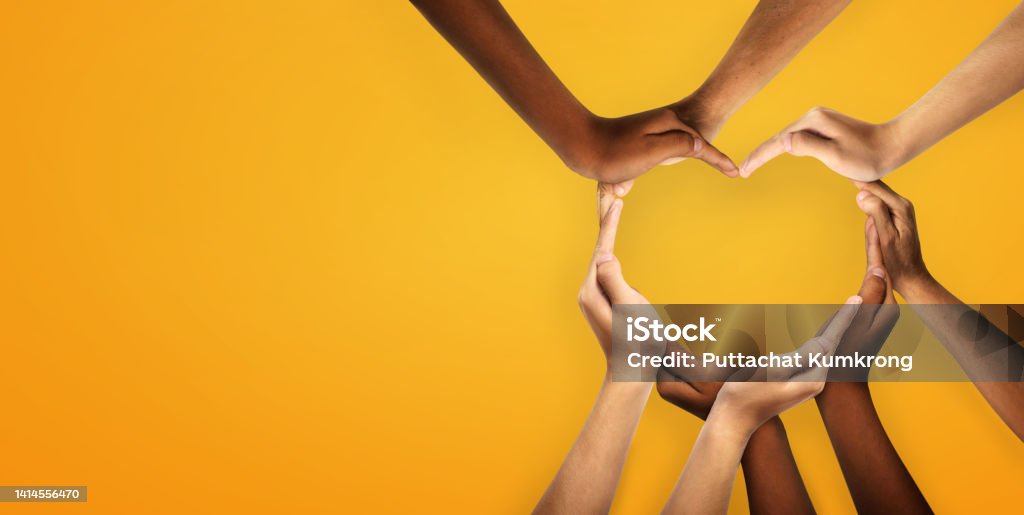 Unity and diversity are at the heart of a diverse group of people connected together as a supportive symbol that represents a sense of and togetherness. Unity and diversity are at the heart of a diverse group of people connected together as a supportive symbol that represents a sense of and togetherness. Symbol and shape created from hands. Heart Shape Stock Photo