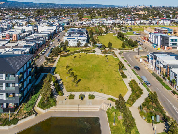 istock Aerial view, high angle looking down on green space in modern housing development 1414557280
