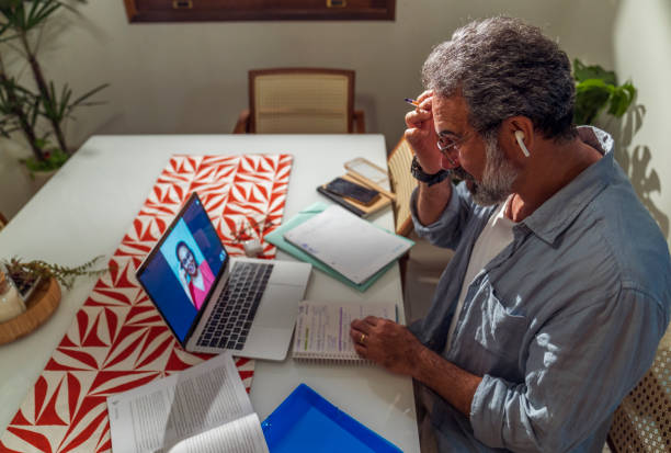 istock Senior man studying a new language online 1414560522