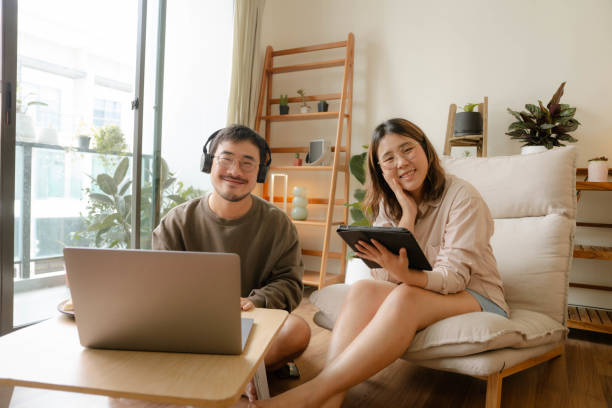 istock Young Asian couple study online together at home 1414562132