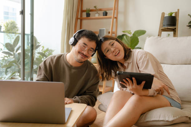 istock Young Asian couple study online together at home 1414562133