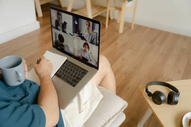 istock Young Asian man studying online alone in a  pleasure home 1414562152