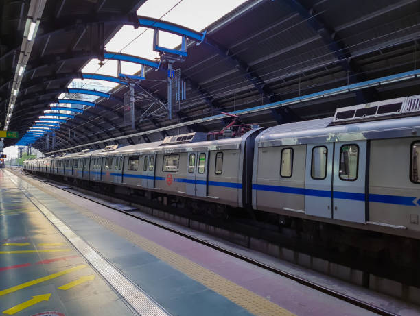 isolated train standing at vacant metro station at day from flat angle image is taken at delhi metro station new delhi india on Apr 10 2022.