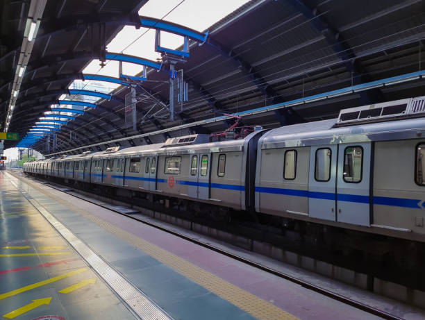 isolated train standing at vacant metro station at day from flat angle isolated train standing at vacant metro station at day from flat angle image is taken at delhi metro station new delhi india on Apr 10 2022. delhi metro stock pictures, royalty-free photos & images