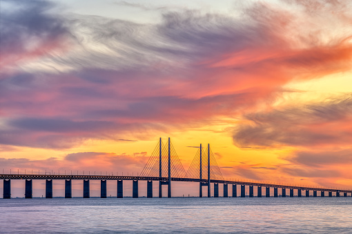 The Oresund bridge between Denmark and Sweden during a spectacular sunset