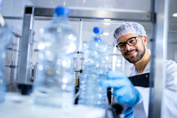 istock Checking quality of drinking water in bottling plant. 1414567302