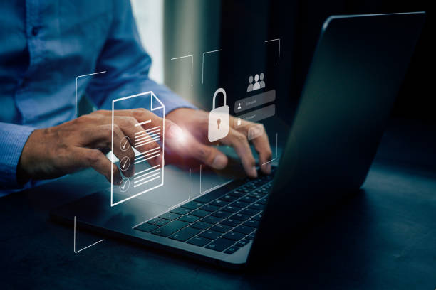 istock Businessmen protecting personal data on laptop and virtual interfaces. 1414568466