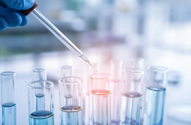 Hand of scientist with test tube and flask in medical chemistry lab. Hand of scientist with test tube and flask in medical chemistry lab, Laboratory research pipette stock pictures, royalty-free photos & images