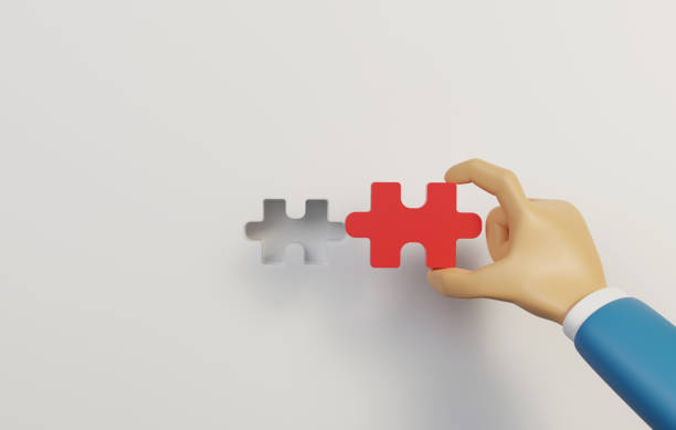 istock Businessman holding red puzzle connecting puzzle pieces on white background. 1414568856
