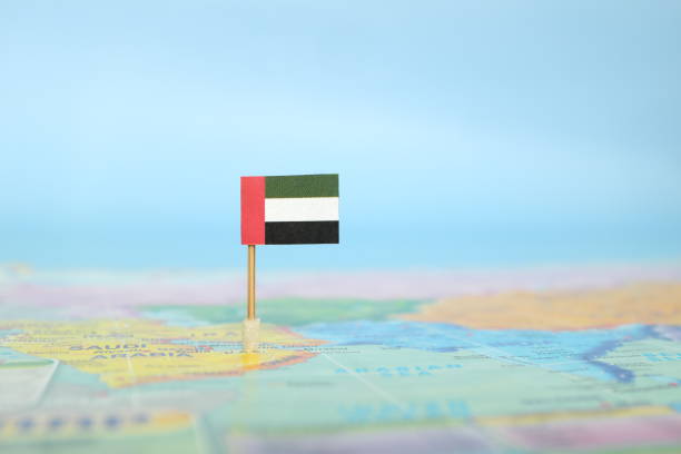 Selective focus of UAE flag in world map. United Arab Emirates country location and sovereignty concept. Selective focus of UAE flag in world map. United Arab Emirates country location and sovereignty concept. united arab emirates flag map stock pictures, royalty-free photos & images