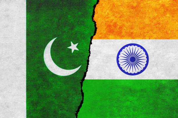 istock Pakistan and India painted flags on a wall with a crack. 1414576265