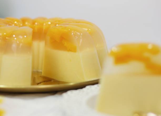 istock two layer of jelly with peach fruit and milk pudding. homemade pudding concept for background. 1414576597