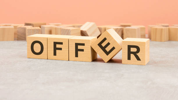 istock word Offer made with wood blocks. text is written in black letters, light background 1414578111