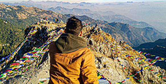 Uttarakhand, India: Young Man Looking at mountains