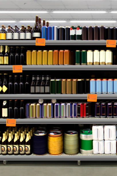 istock Beer bottles and cans on shelf vertical. 1414579418