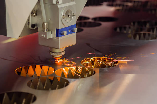 istock CNC laser cutting machine working with sheet metal with sparks 1414581738