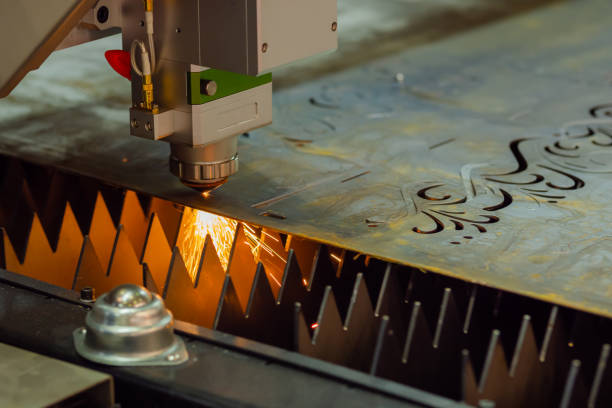 istock Laser cutting machine working with sheet metal with sparks 1414581747