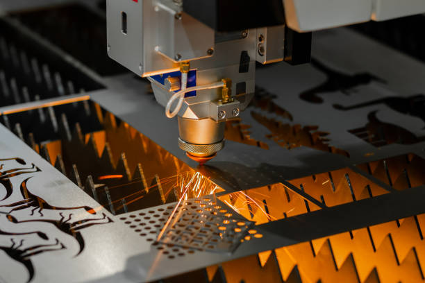 istock Laser cutting machine working with sheet metal with sparks 1414581759