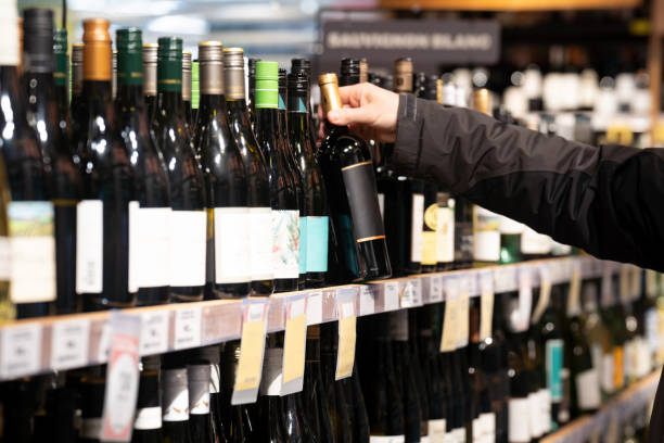 istock Shelves in the bottle store. Close-up 1414583096