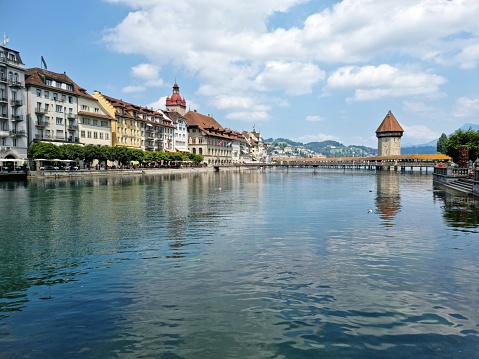 The beautiful Kapellbrücke of Lucerne in Switzerland, captured during a sunny day during summer season.