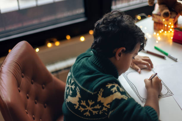 istock Kids drawing Christmas cards 1414587619