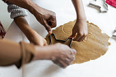 istock Grandmother making Christmas gingerbread cookies with her granddaughter 1414591140