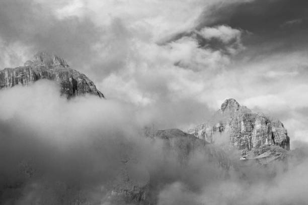 istock dramatic sky on mountain peaks of italian alps 1414593217