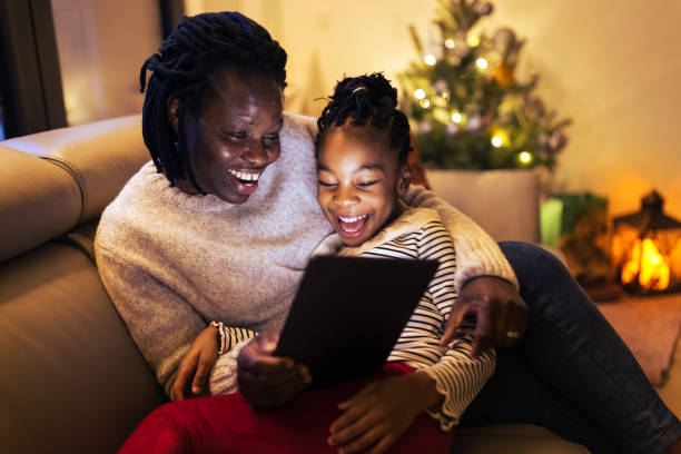 istock Mother and daughter having video call 1414593823