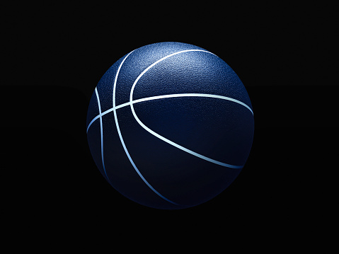 Basketball ball against black background. Graphical element with abstract concept of sport equipment. 3D Illustration.