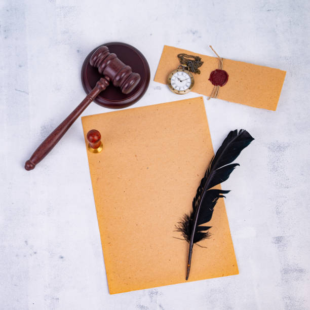 istock Notary's public pen and stamp on testament and last will. Notary public tools 1414595800