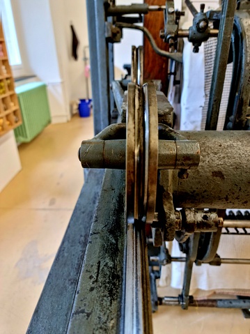 Close-up of an old Embroidery Machine captured in a collection of antique textile machines.