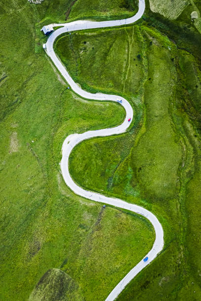 istock Top down view of white serpentine on green hills, Dolomites 1414602543